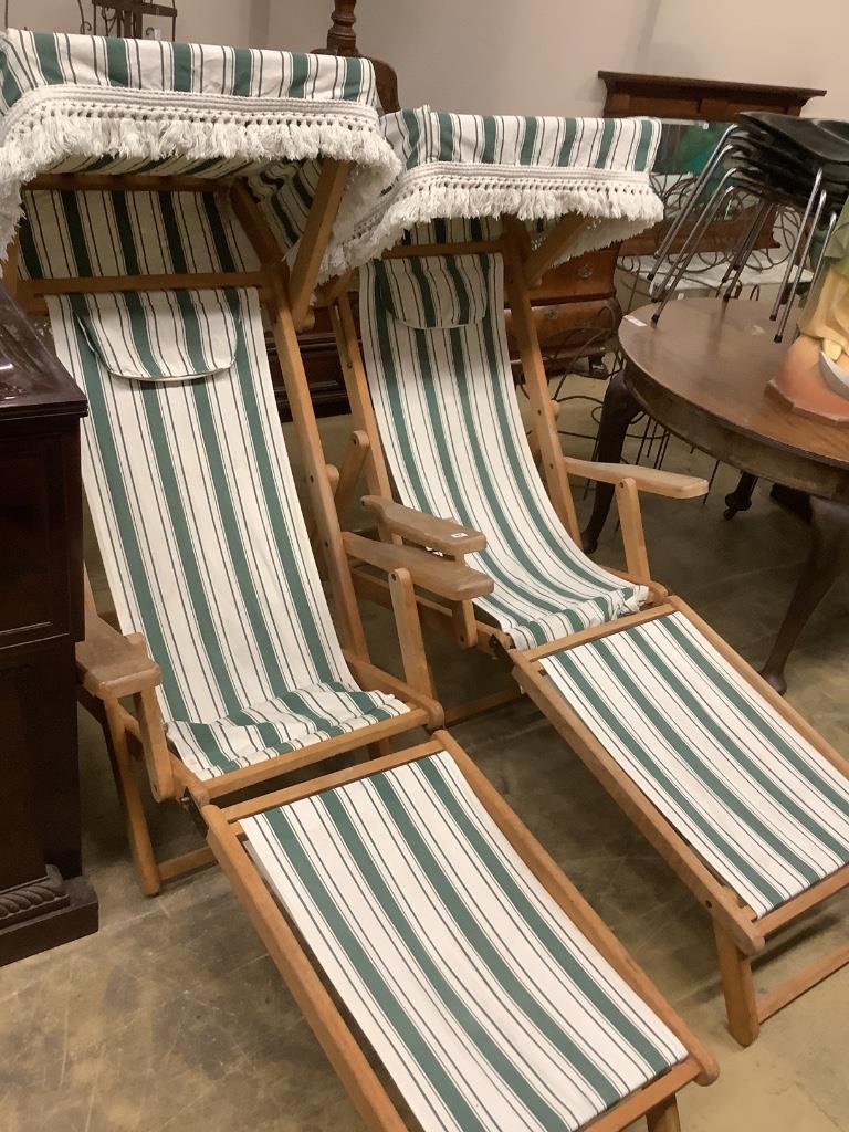 A pair of beech garden deck chairs with folding sun canopies by Sarah Burgoyne